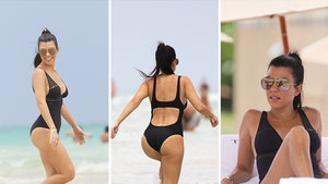 0702-kourtney-kardashian-bikini-gallery-primary-splash-01