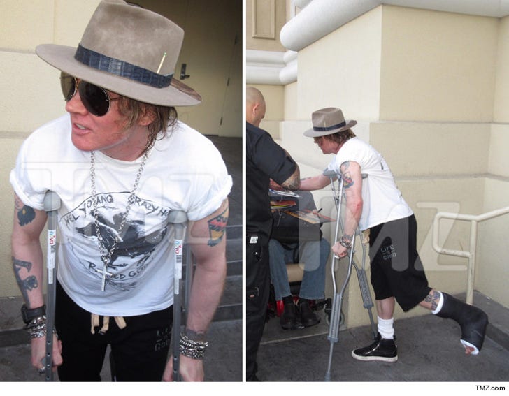 Axl Rose -- All Crutched Up And Ready To Rock :: 0408-axl-rose-broken-leg-signing-autographs-tmz-4