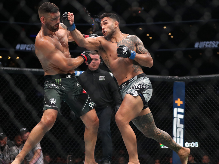 Brad Tavares throws a punch against Chris Weidman